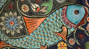 A vibrant colorful illustration of happy children singing and dancing around a cheerful ca