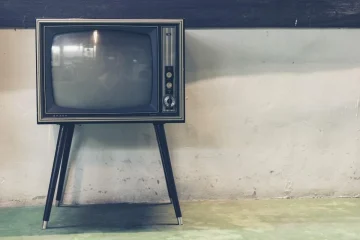 Nostalgic children watching a classic cartoon on an old TV set evoking childhood memories