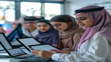 Saudi students and parents looking at an academic calendar on a tablet or computer with a