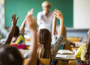 students in a classroom with a teacher